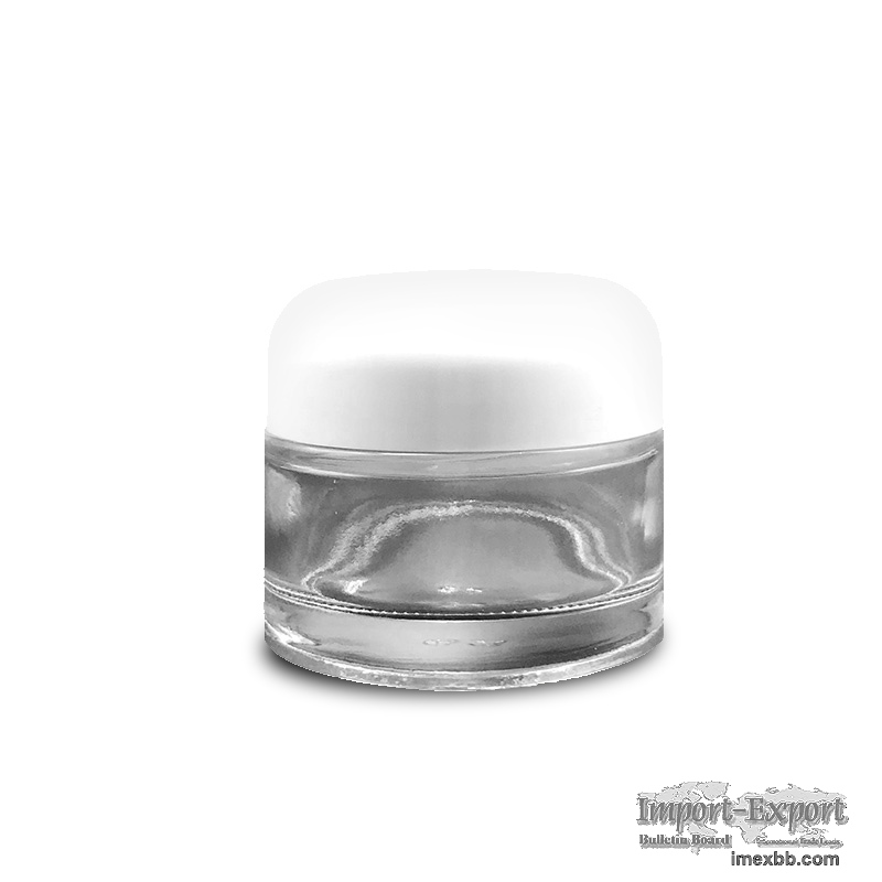 Glass cream jar with round white lid